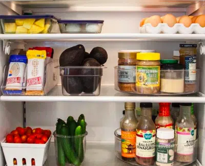 fridge with lazy susans containing condiments