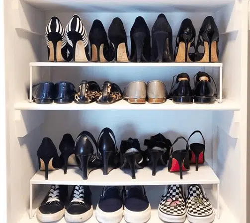 high heels and sneakers placed in a shoe cabinet