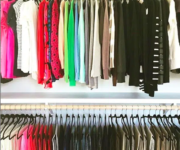 shirts and pants in an organized closet