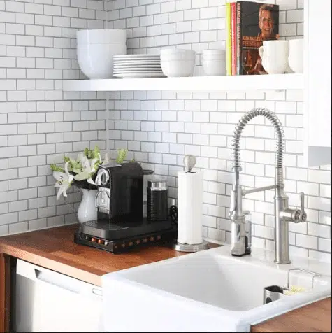 a beautiful kitchen with white subway tile