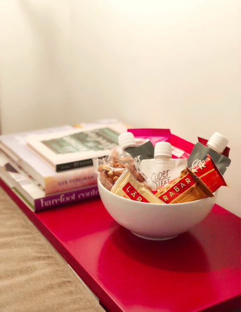 bedside table with a bowl of snacks