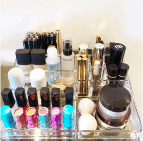 cosmetics arranged in an acrylic tray