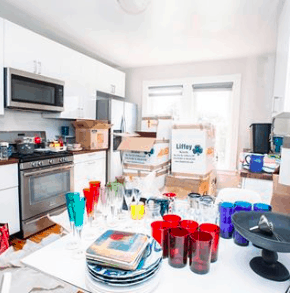 a cluttered kitchen in the middle of a move
