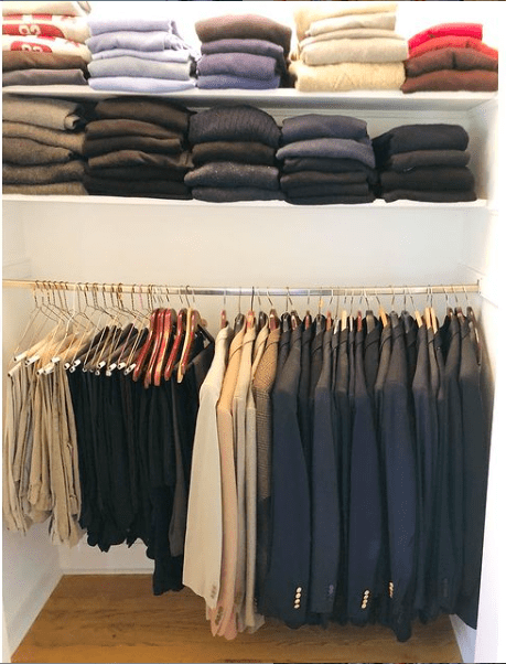 a man's closet with the correct amount of clothes