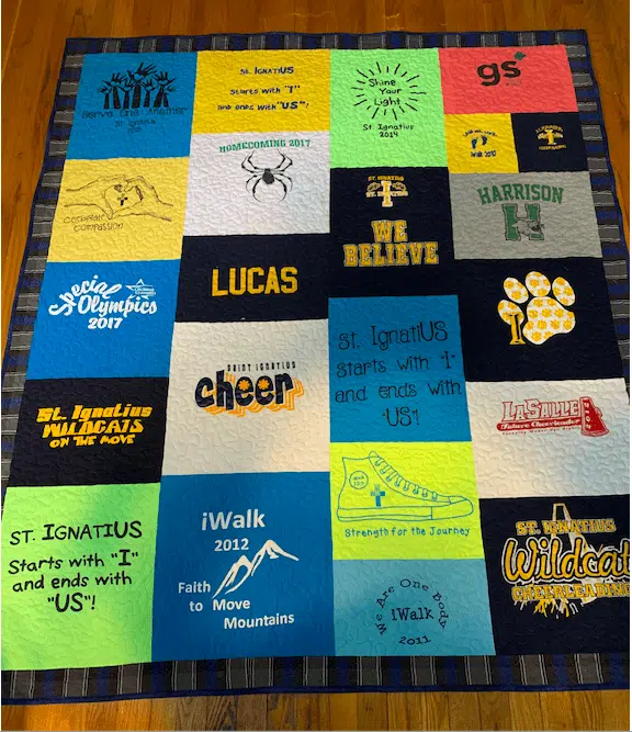 a colorful quilt made of t-shirts