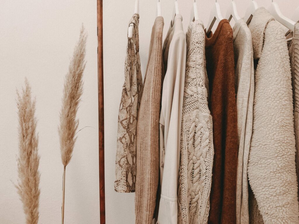 brown clothes sorted on a clothing rack