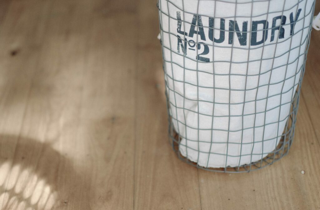 wire laundry basket with writing