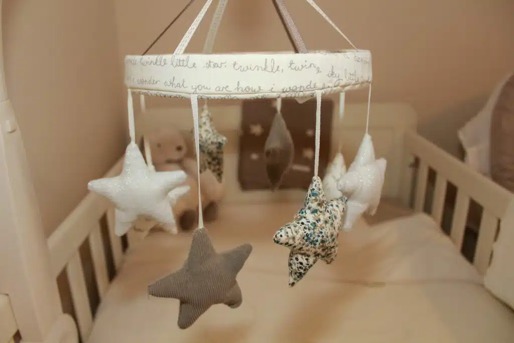 mobile with stars over a crib