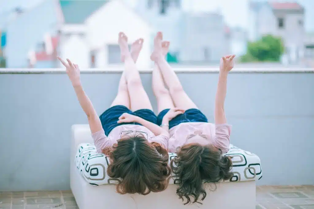 Two teen girls on a balcony