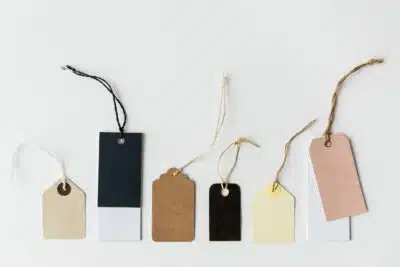 neutral colored gift tags on white background