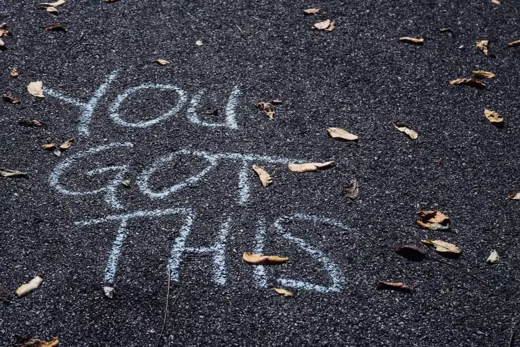 chalk writing of you got this on asphalt