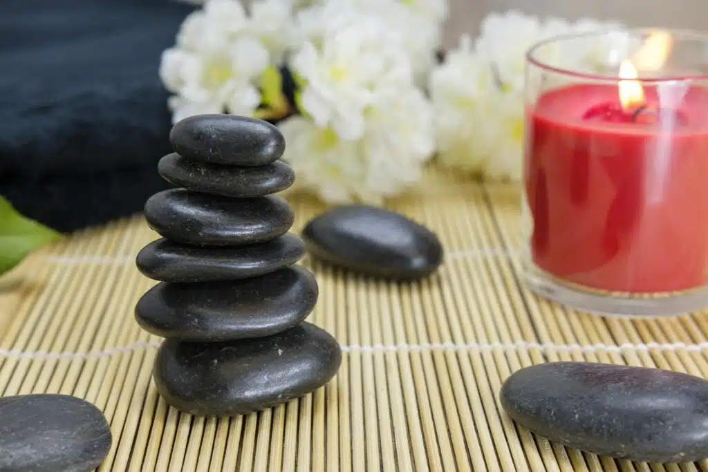 Zen rocks and a lit candle